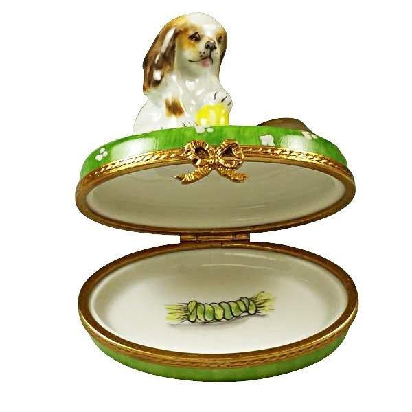 Fine French craftsmanship on the Spaniel Puppy with Ball and Bowl Limoges box, painted by hand
