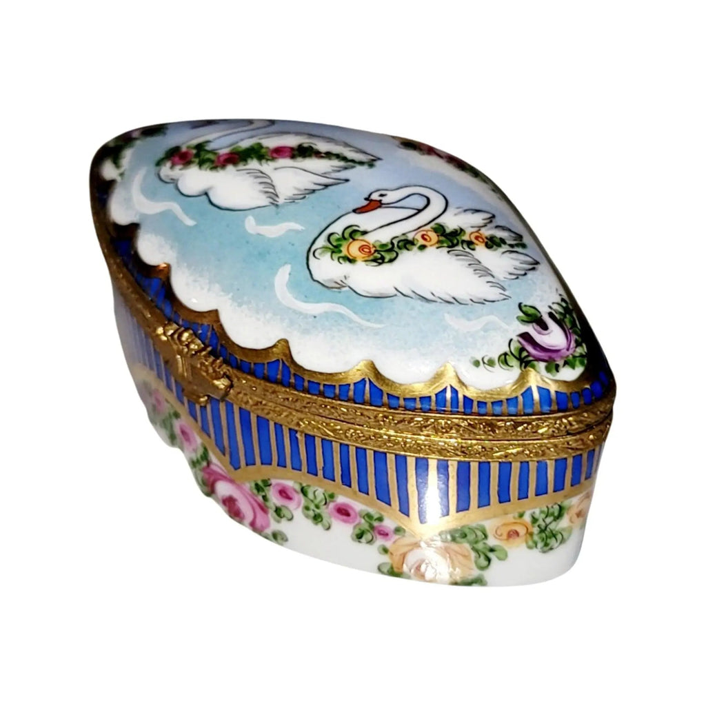 Every brushstroke by hand on the Swans Traditional Sevre Roses Limoges box from France