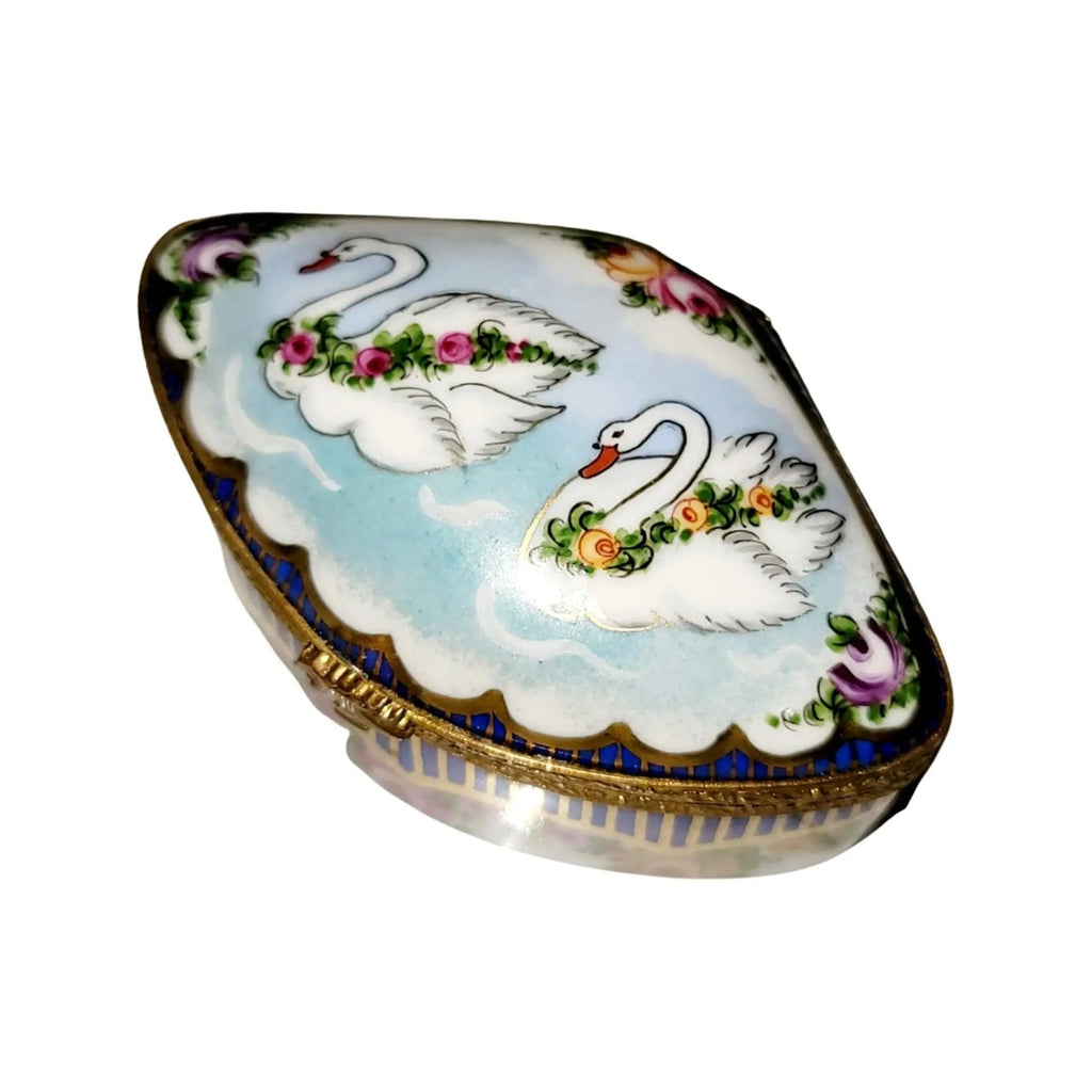 Fine art lovers will admire this Swans Traditional Sevre Roses Limoges box