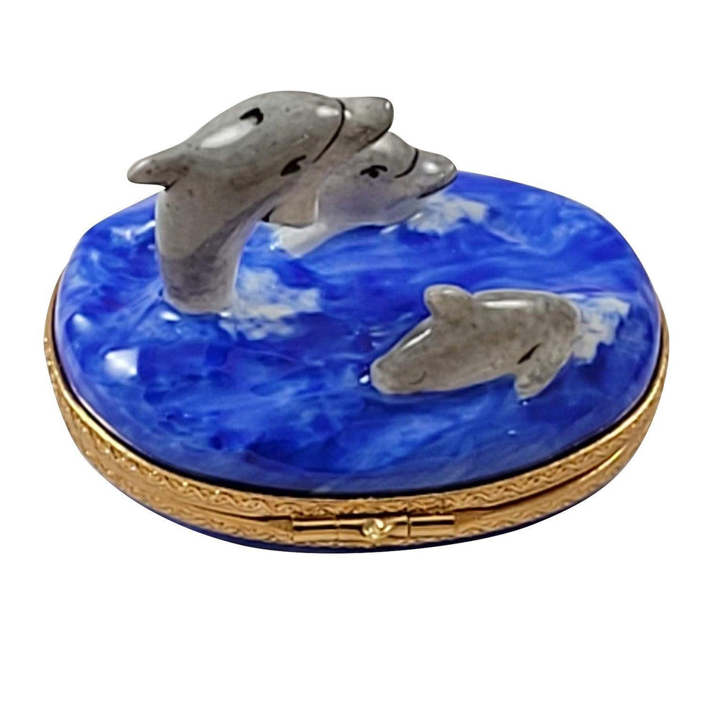 Fine French craftsmanship on the Three Dolphins Limoges box, painted by hand