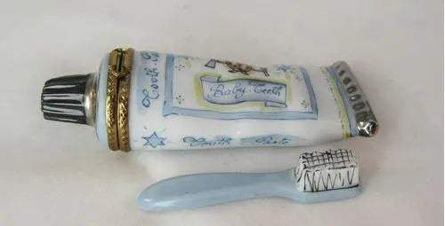 Fine art lovers will admire this Toothpaste Baby Tooth Limoges box