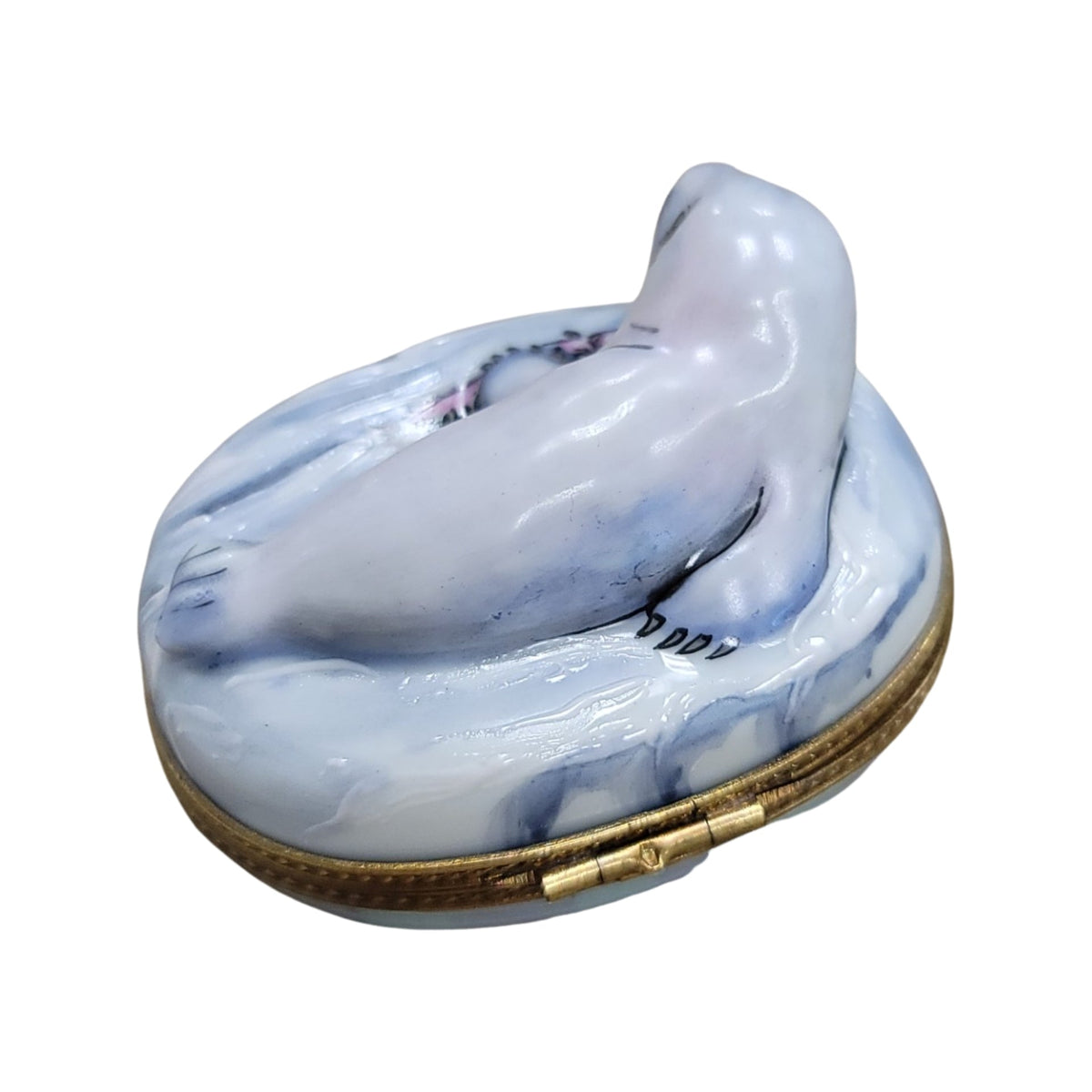Every brushstroke by hand on the White Sea Lion Limoges box from France