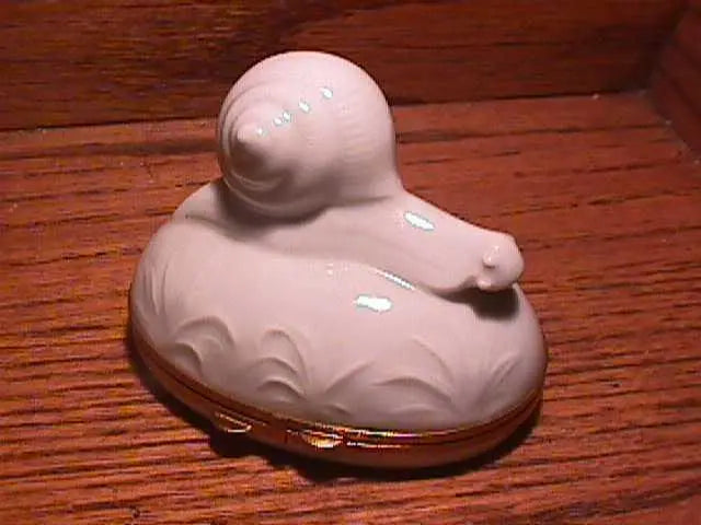 Fine French craftsmanship on the White Snail Chamart Limoges box, painted by hand