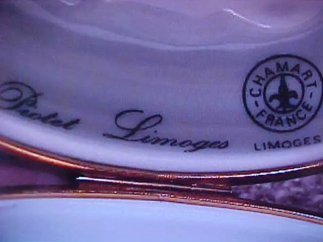 Painted details on the White Snail Chamart Limoges box, French art in miniature