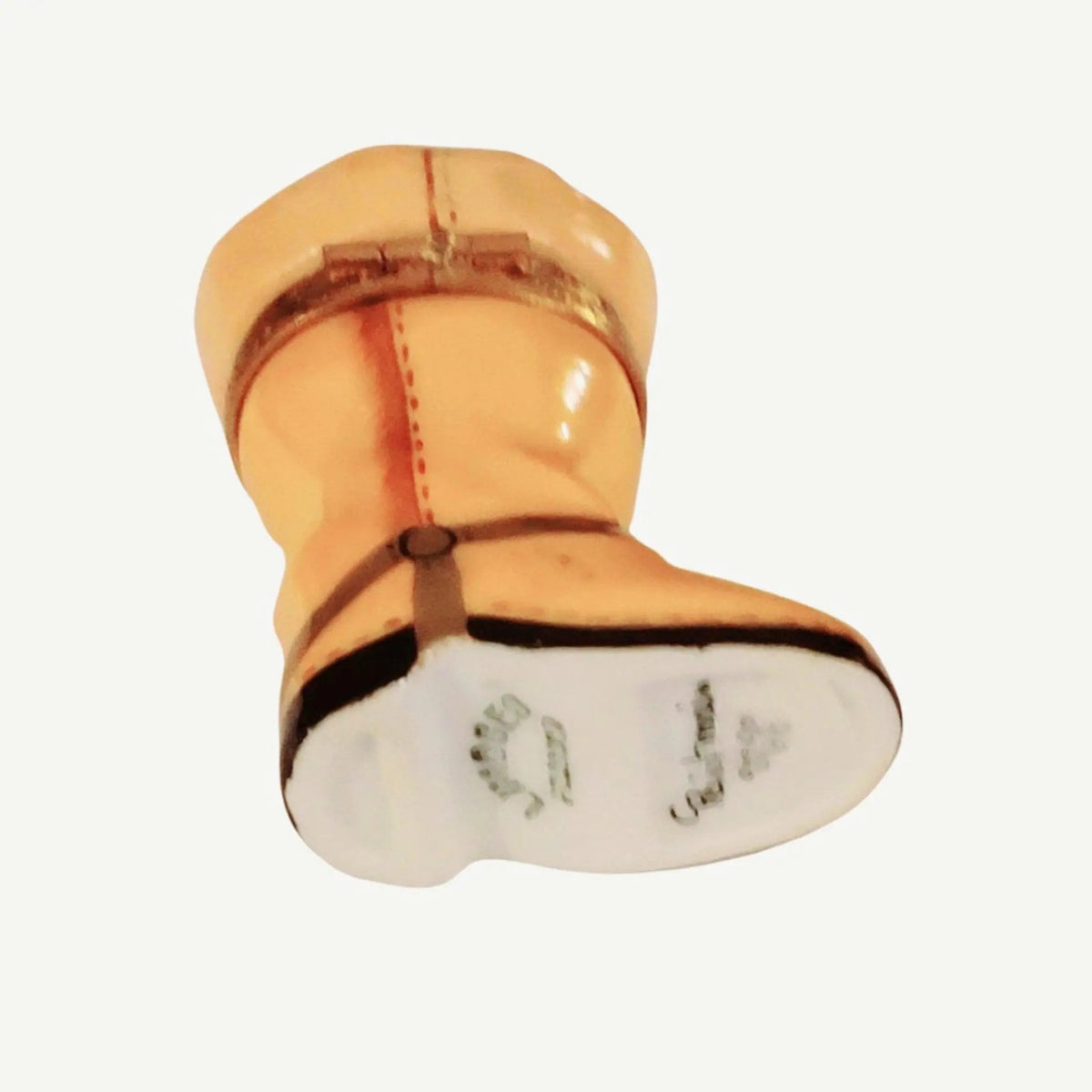 Fine French craftsmanship on the Yellow Riding Boot Cowboy Limoges box, painted by hand