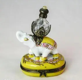 Artisan-painted Yellow Imperial Elephant Perfume Limoges box from France, a cherished collectible
