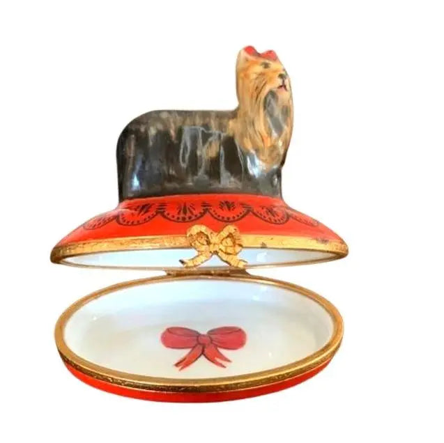 Yorkie Limoges box opened to reveal a red bow painted inside, a sweet keepsake for dog lovers