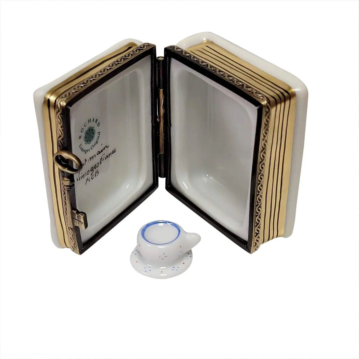 The Alice in Wonderland Book with Tea Cup, a Limoges keepsake with true French charm