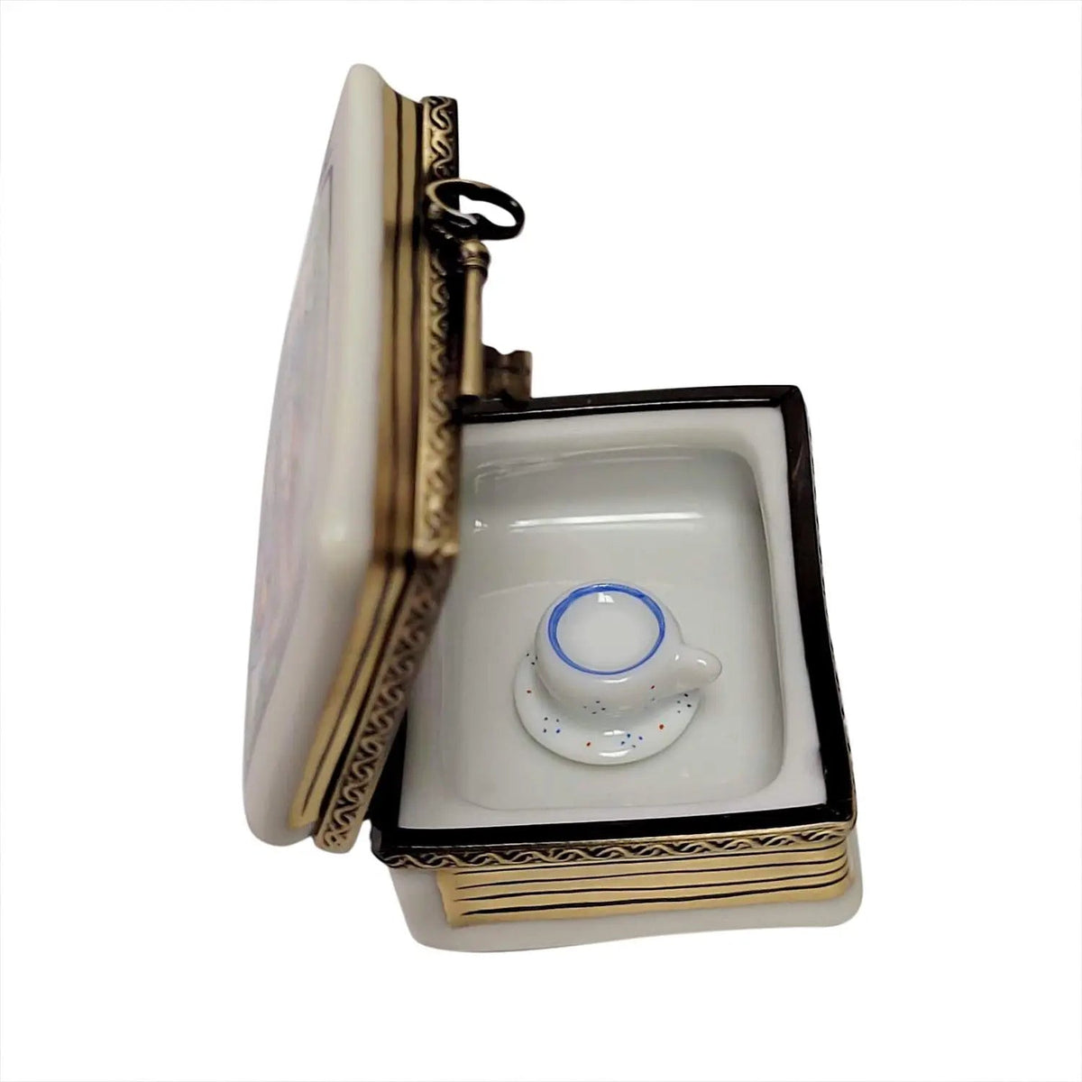 Alice in Wonderland Book with Tea Cup Limoges box, an heirloom-quality piece for collectors