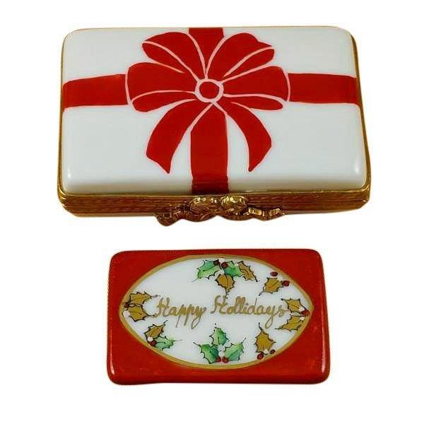 Gift Box with Red Bow Happy Holidays Limoges Box Keepsake, a hand-painted Limoges porcelain gift