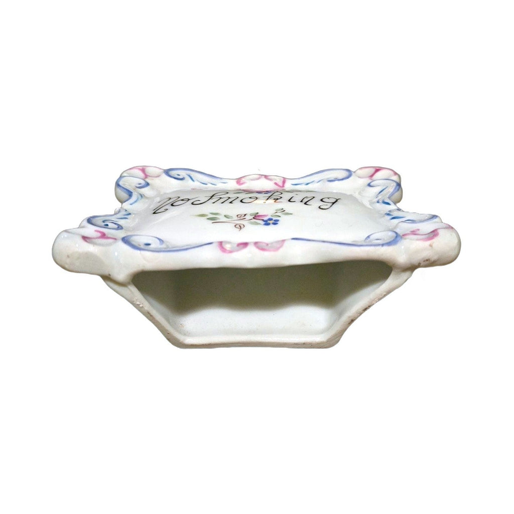 Bottom view of the No Smoking Limoges plaque showing its hollow stand