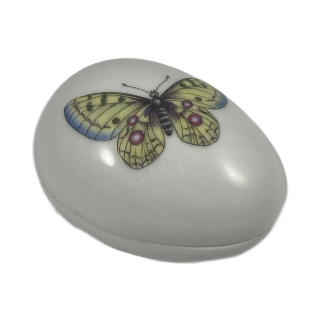 White porcelain egg Limoges box with a painted yellow butterfly, no hinge, made in France