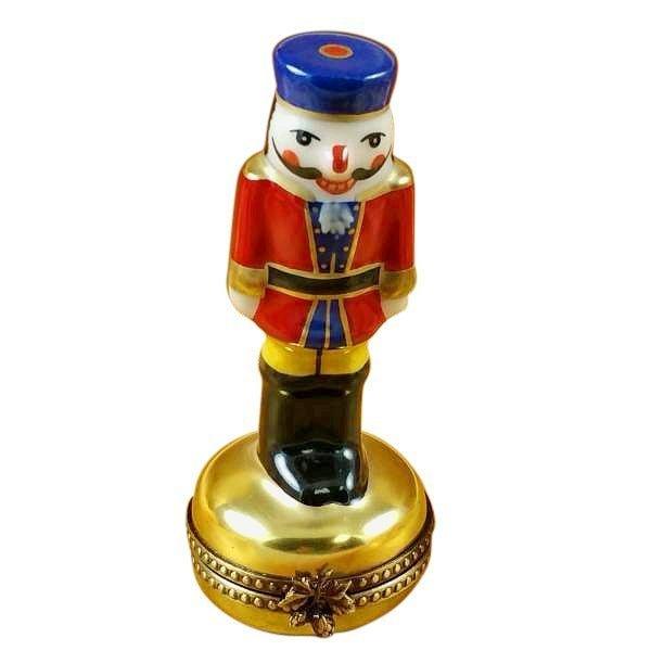 Nutcracker Gold Base Limoges Box for Holiday Decor, a hand-painted Limoges porcelain gift