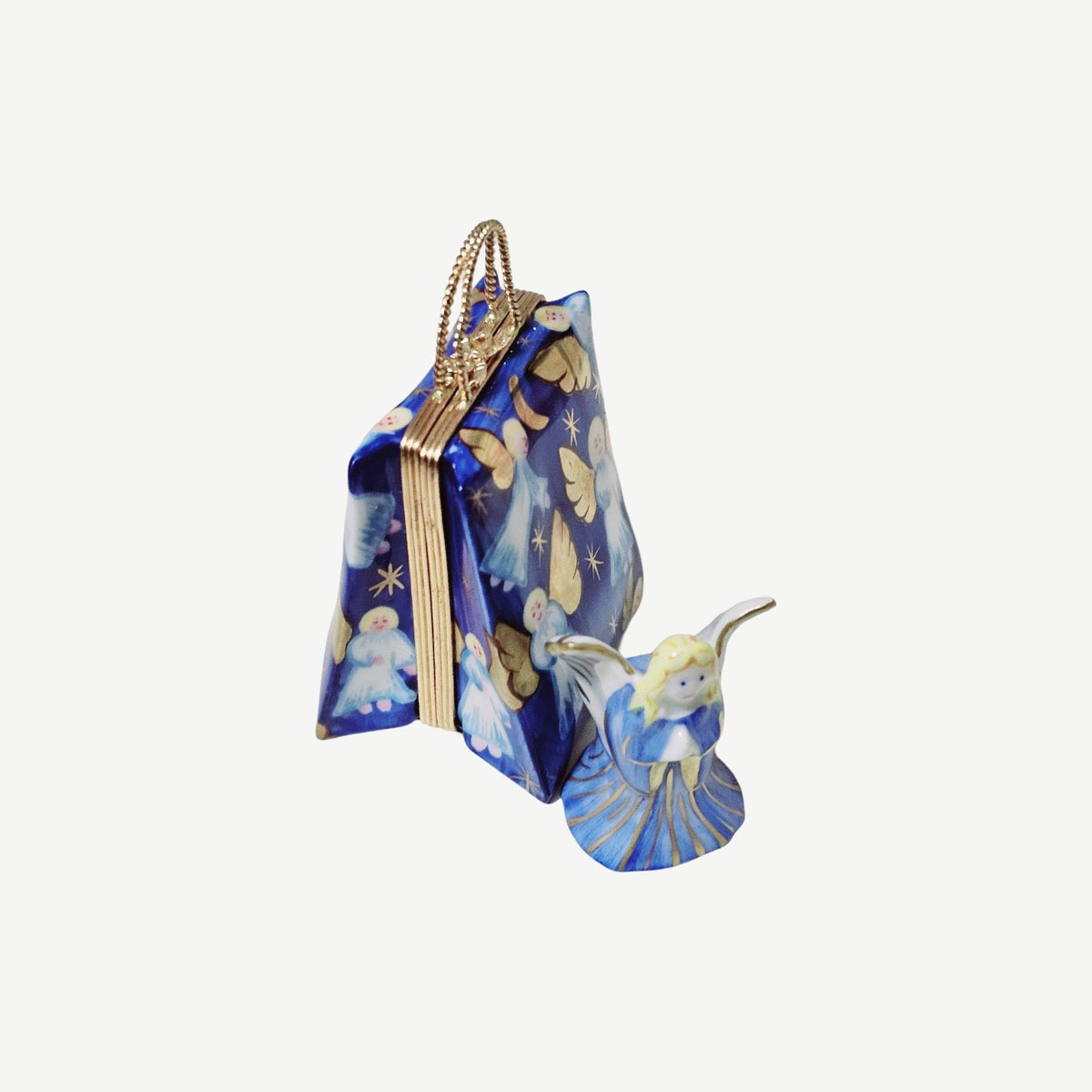 Fine French craftsmanship on the Angel Shopping Bag Luxury Limoges box, painted by hand