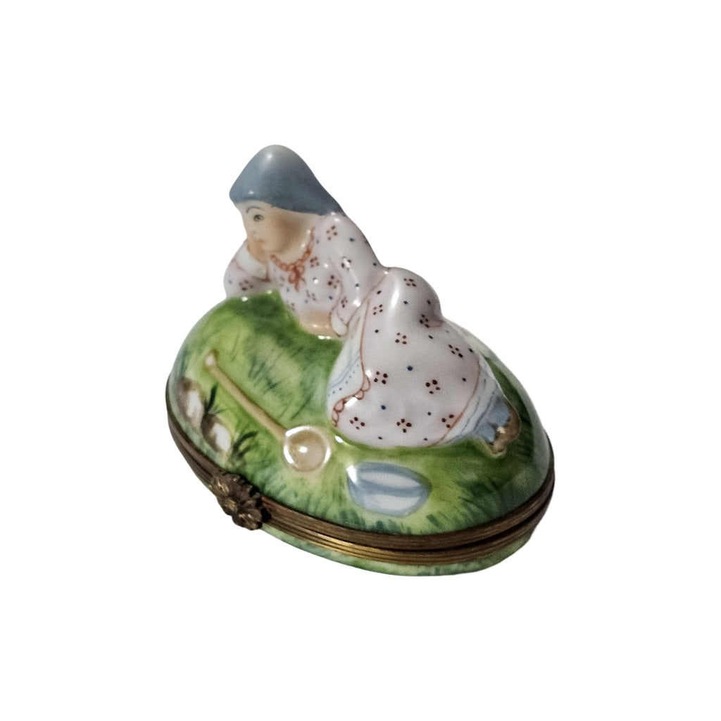 Peasant Woman Laying on Grass, a hand-painted Limoges porcelain gift