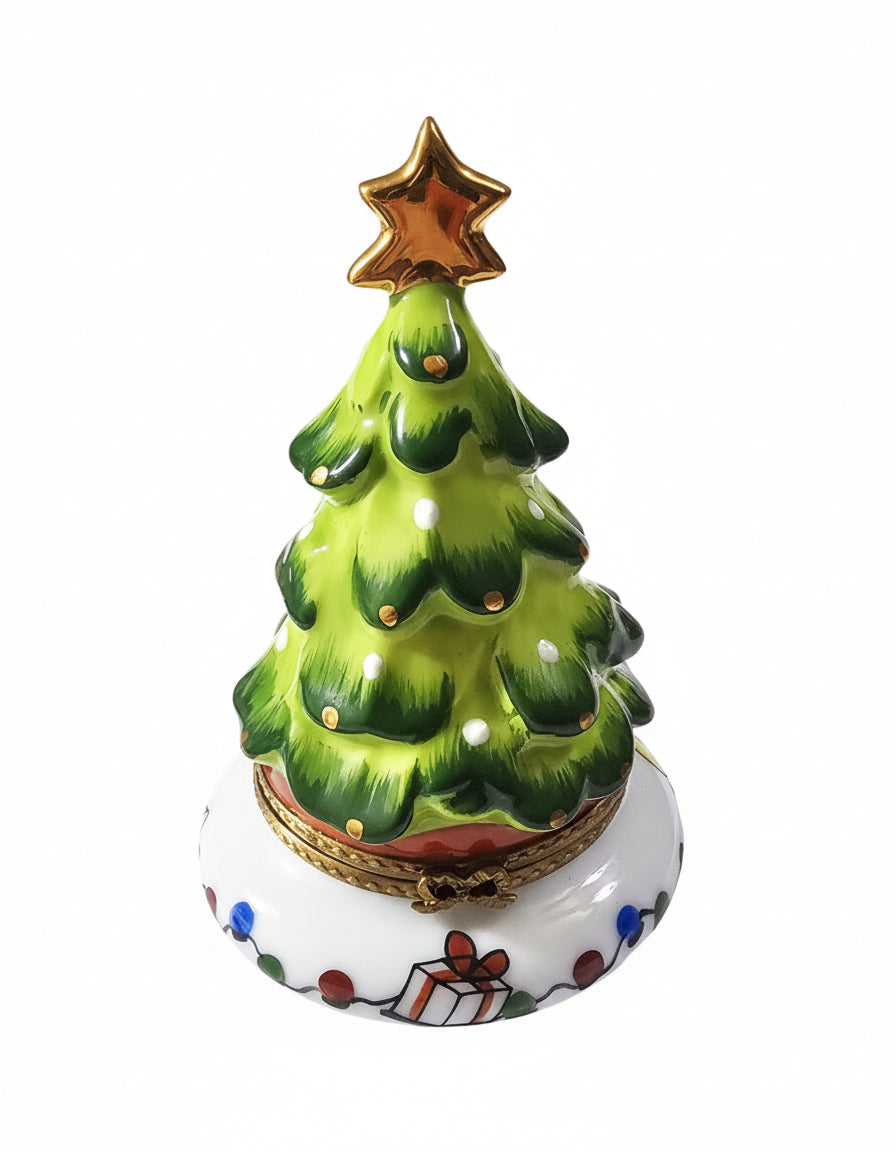 Limoges Boutique presents the Christmas Tree with Doll Inside 4.25, a genuine Limoges box painted by hand in France