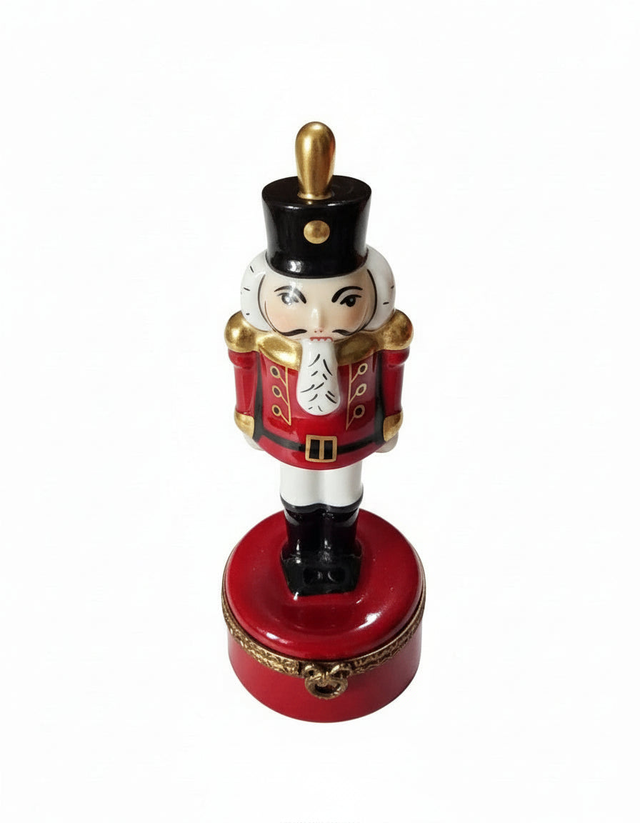 Red Nutcracker w Plum PV, a hand-painted Limoges porcelain gift