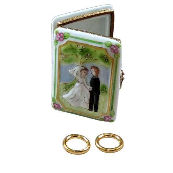 Fine art lovers will admire this Wedding Book with 2 Removable Gold Rings Limoges box